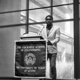 Mamadou speaking at podium