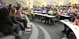 Students gather in a classroom